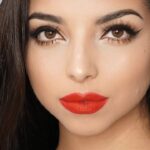 Achieve a flawless look with natural makeup and stunning red lips. Perfect for those interested in enhancing their beauty. Click here for a radiant and glamorous appearance.